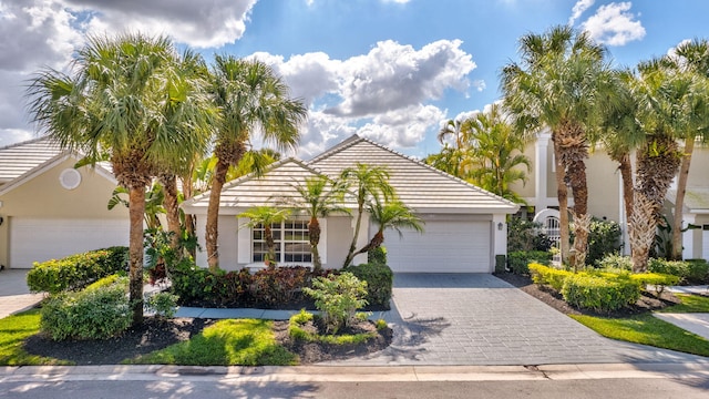9158 Heathridge Dr, West Palm Beach, FL 33411 - view of front of home with a garage
