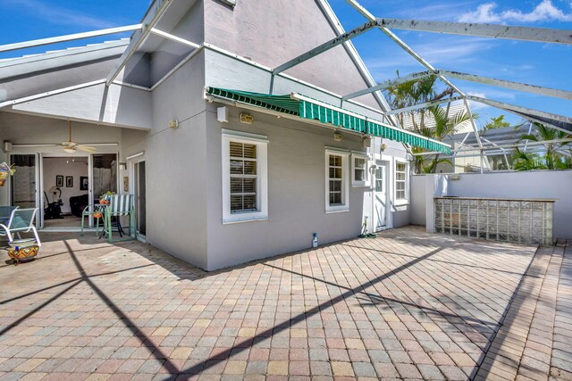 9158 Heathridge Dr, West Palm Beach, FL 33411 - view of patio featuring ceiling fan and glass enclosure