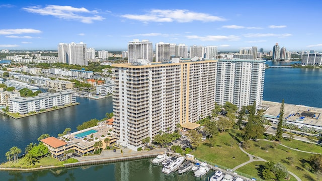 drone / aerial view featuring a water view and a city view