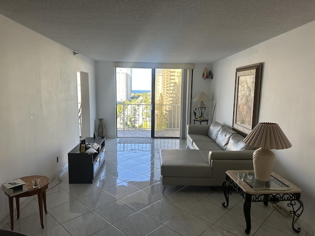 290 174th St Unit 1111, Sunny Isles Beach, FL 33160 - living room featuring tile patterned floors and a textured ceiling