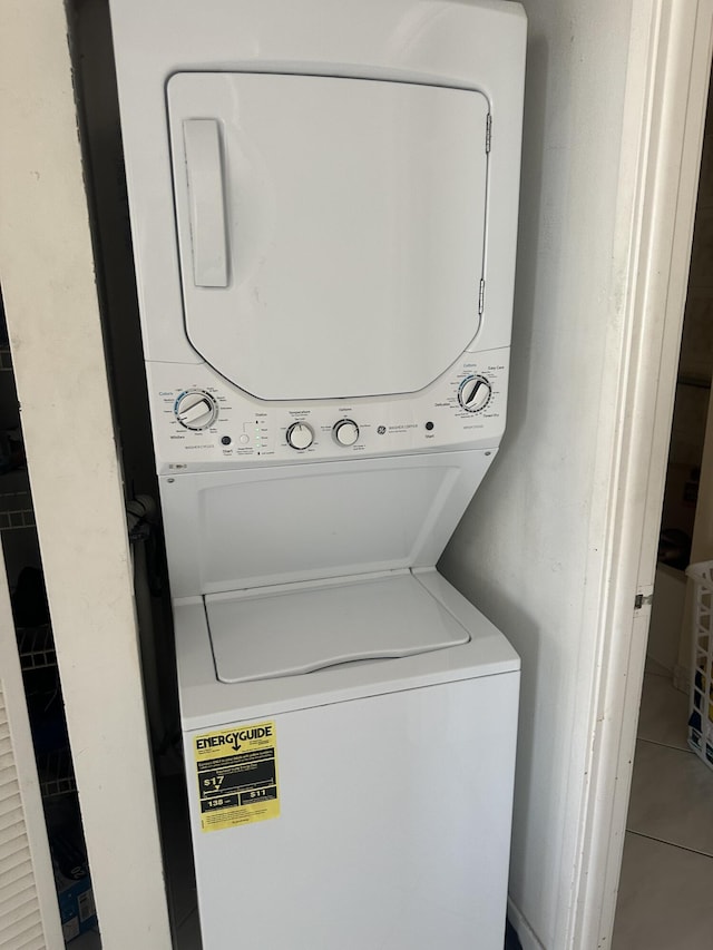 290 174th St Unit 1111, Sunny Isles Beach, FL 33160 - laundry area featuring stacked washer / drying machine and tile patterned floors