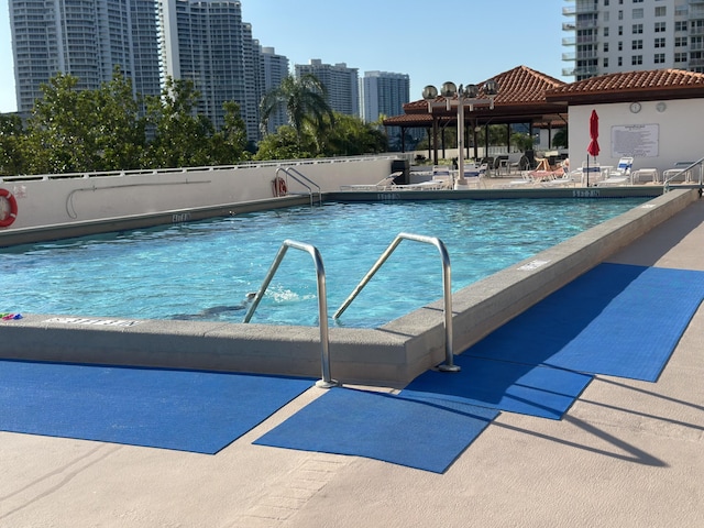 290 174th St Unit 1111, Sunny Isles Beach, FL 33160 - community pool with a patio area