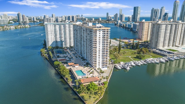 birds eye view of property featuring a view of city and a water view