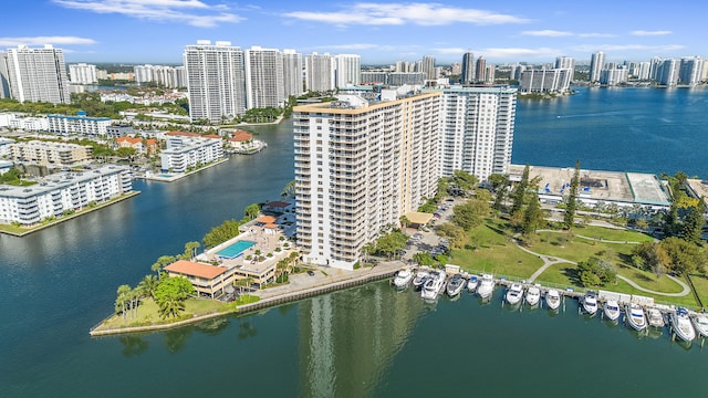 birds eye view of property featuring a view of city and a water view