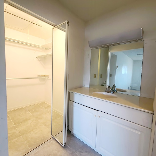 bathroom featuring tile patterned floors and vanity