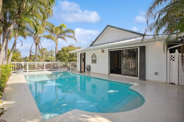 view of swimming pool featuring a patio area