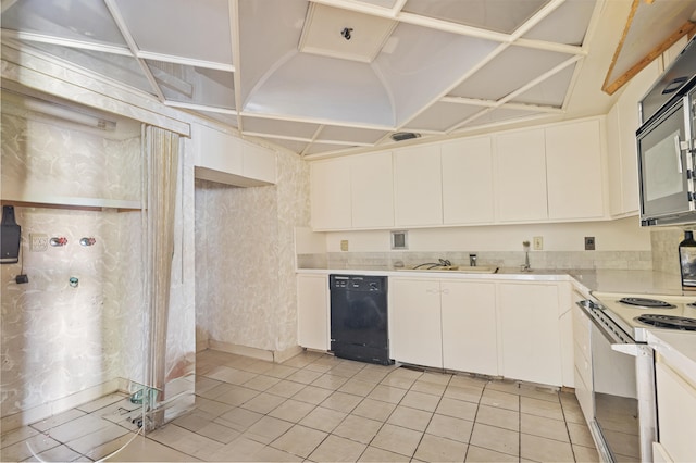 2802 N 46th Ave Unit B513, Hollywood, FL 33021 - kitchen with black appliances, a sink, white cabinets, light countertops, and light tile patterned floors