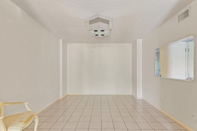 2802 N 46th Ave Unit B513, Hollywood, FL 33021 - unfurnished room featuring light tile patterned floors, visible vents, and a textured ceiling