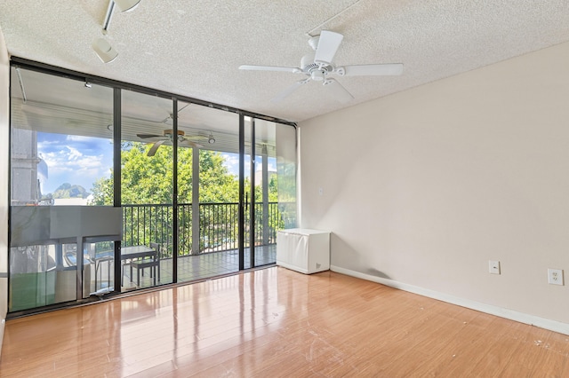 2802 N 46th Ave Unit B513, Hollywood, FL 33021 - spare room with ceiling fan, wood finished floors, baseboards, and a textured ceiling