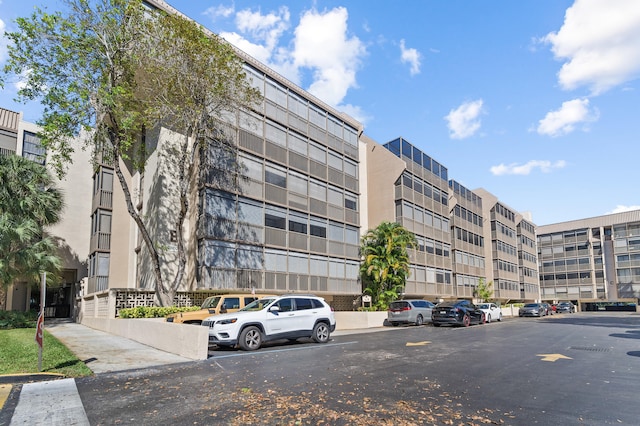 view of property with uncovered parking