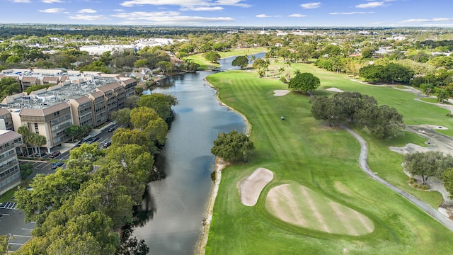 birds eye view of property featuring a water view and golf course view