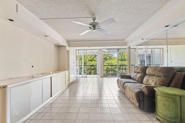 2802 N 46th Ave Unit B513, Hollywood, FL 33021 - living area with light tile patterned floors, a textured ceiling, and ceiling fan