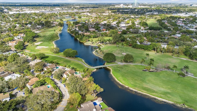 aerial view featuring golf course view, a water view, and a residential view