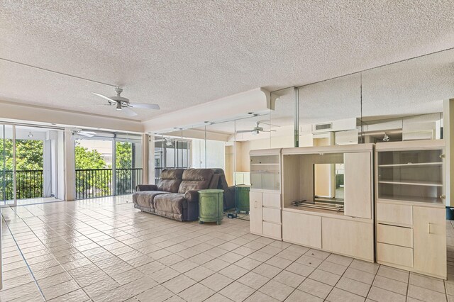 2802 N 46th Ave Unit B513, Hollywood, FL 33021 - unfurnished living room with visible vents, a textured ceiling, light tile patterned flooring, and a ceiling fan