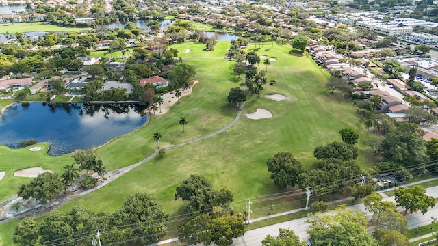 aerial view featuring a residential view, view of golf course, and a water view