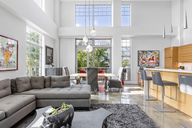 living room with a high ceiling