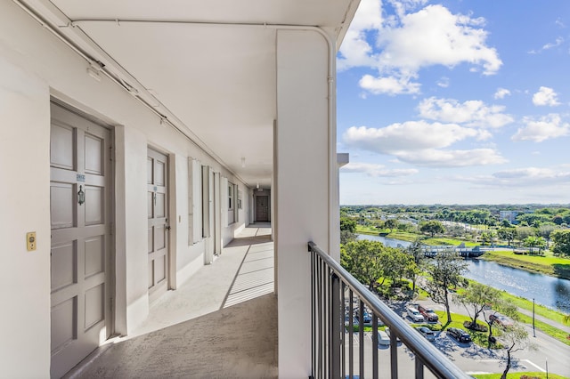 balcony featuring a water view