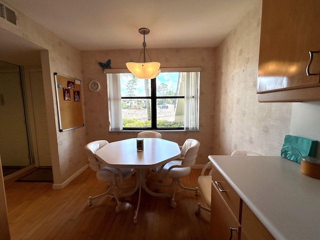 dining area featuring wood-type flooring