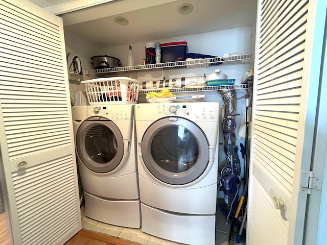 laundry room with washer and dryer