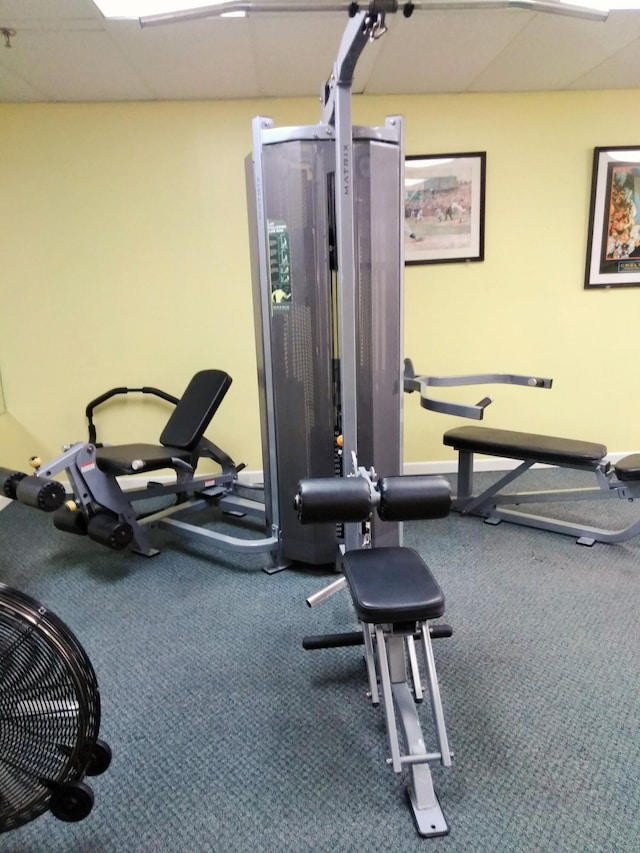 workout area with a paneled ceiling