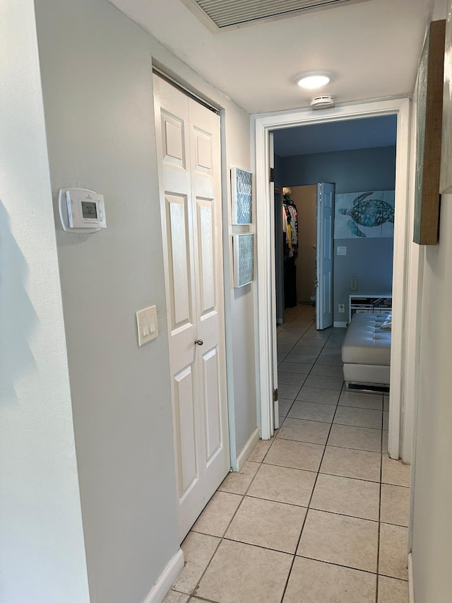 hallway with light tile patterned floors