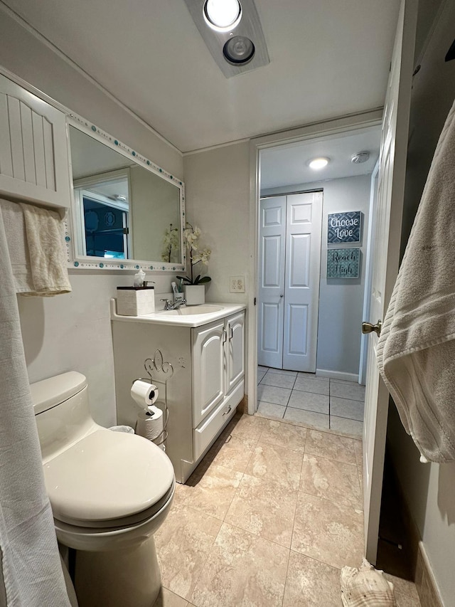 bathroom featuring vanity and toilet