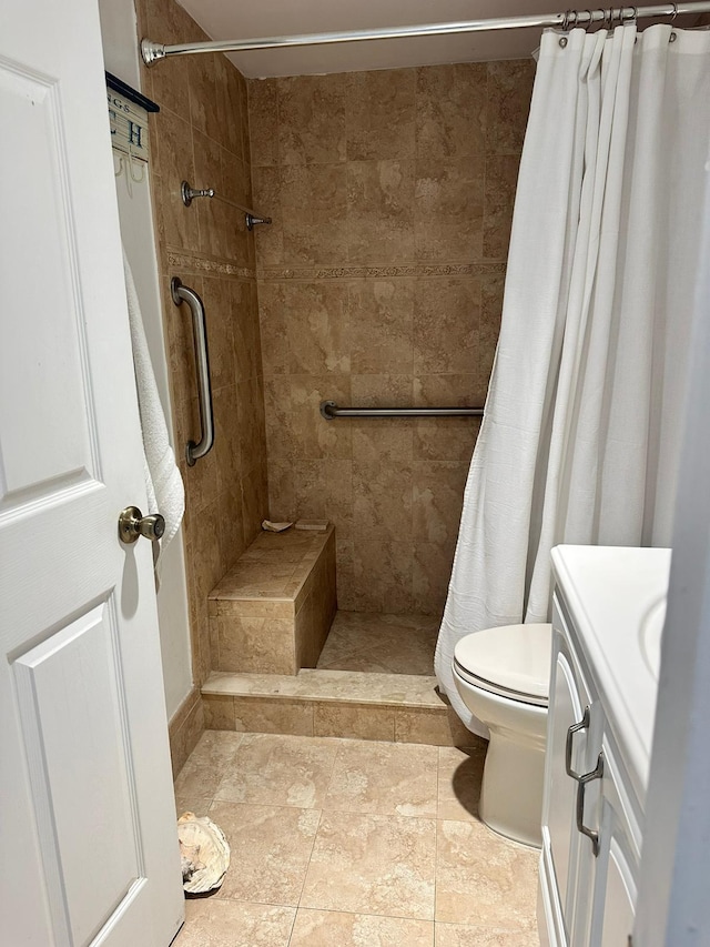 bathroom featuring vanity, toilet, and walk in shower