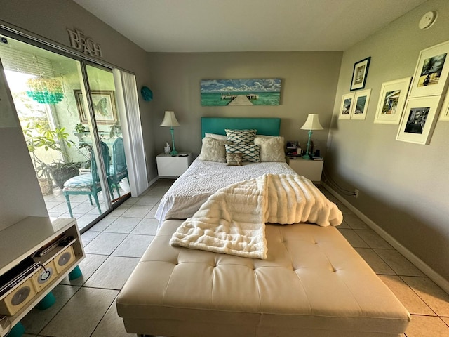 tiled bedroom featuring access to exterior and multiple windows