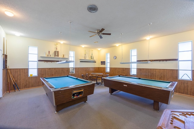 recreation room with plenty of natural light, wood walls, and billiards