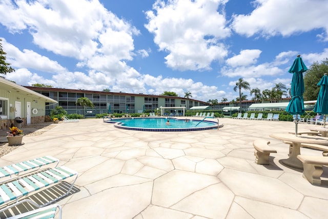 view of swimming pool with a patio