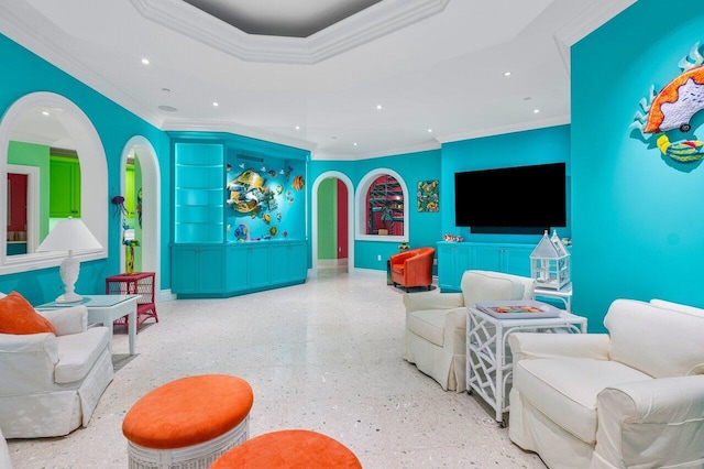 living room featuring recessed lighting, a raised ceiling, arched walkways, and speckled floor