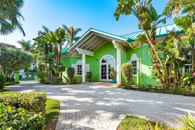 view of side of property with stucco siding