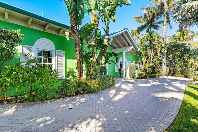 view of side of home featuring stucco siding