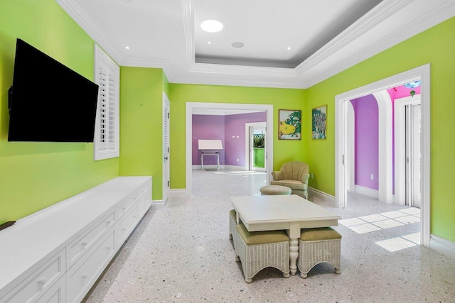 sitting room with ornamental molding, a tray ceiling, baseboards, and recessed lighting