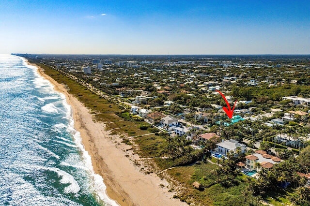 aerial view featuring a view of the beach and a water view