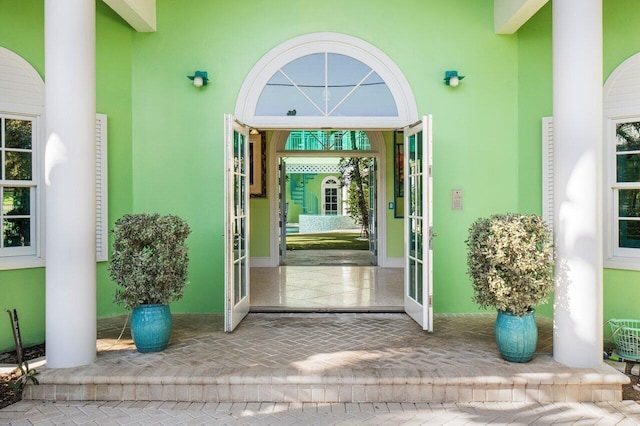 entrance to property featuring stucco siding