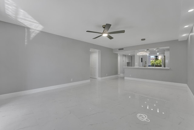 unfurnished living room with ceiling fan