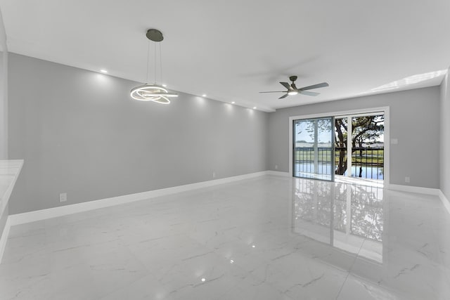 unfurnished room featuring ceiling fan