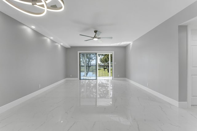 unfurnished room with ceiling fan