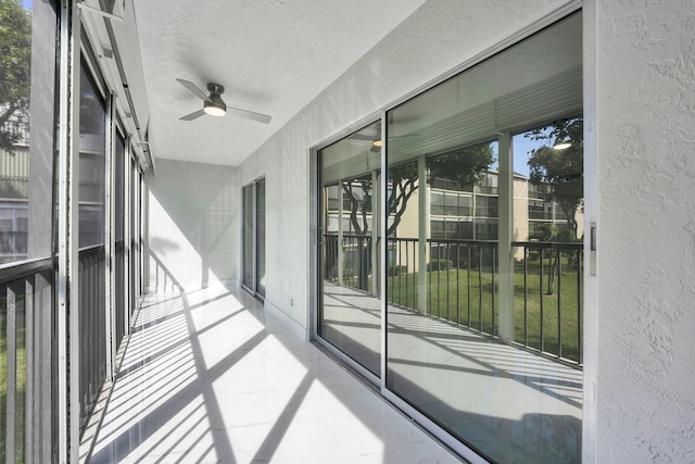 balcony featuring ceiling fan