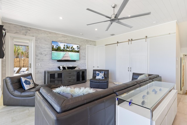 living area featuring visible vents, ceiling fan, a barn door, recessed lighting, and wooden ceiling