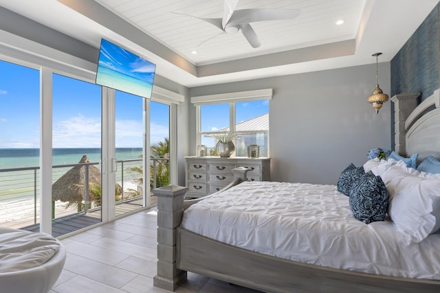 bedroom with ceiling fan, a raised ceiling, access to exterior, and recessed lighting