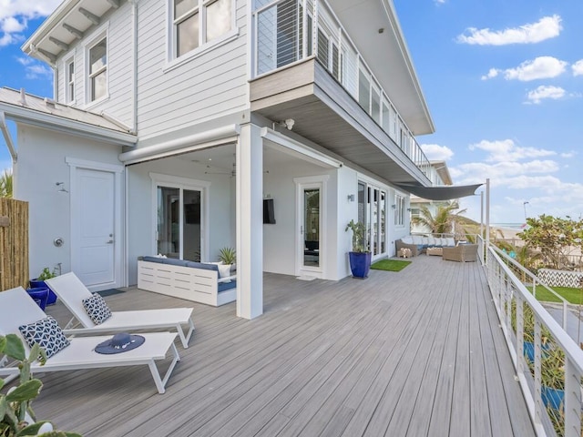 wooden deck with outdoor lounge area