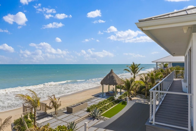 property view of water featuring a beach view