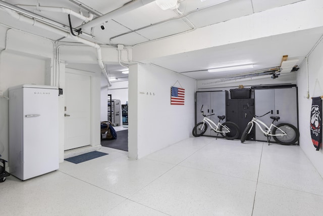 garage featuring freestanding refrigerator