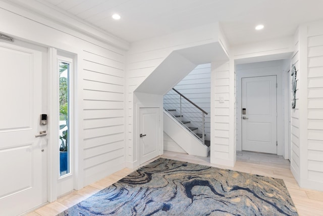 entrance foyer featuring recessed lighting, stairway, and light wood-style floors