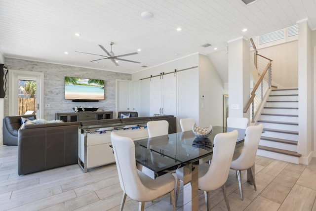 dining space with ceiling fan, stairway, wood ceiling, a barn door, and recessed lighting