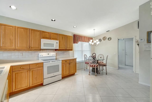 kitchen featuring white appliances, an inviting chandelier, hanging light fixtures, backsplash, and vaulted ceiling