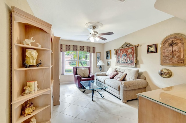 tiled living room with ceiling fan