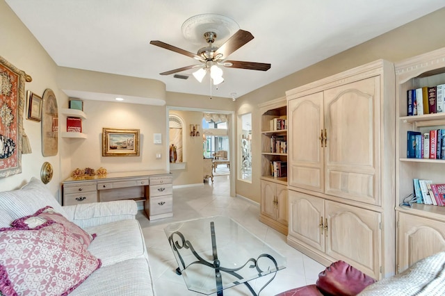 tiled living room featuring ceiling fan